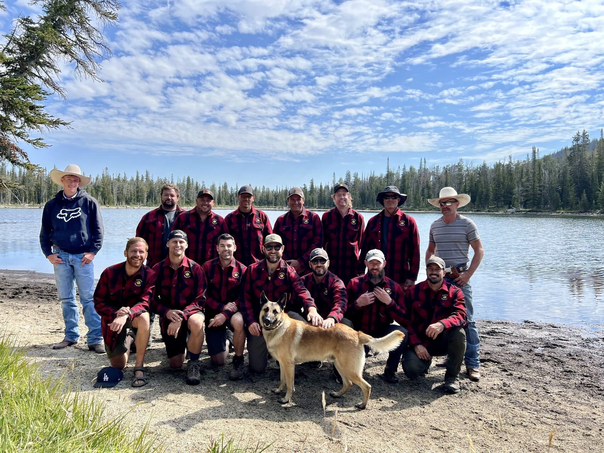 A Happy Hustle Club cohort together by the lake